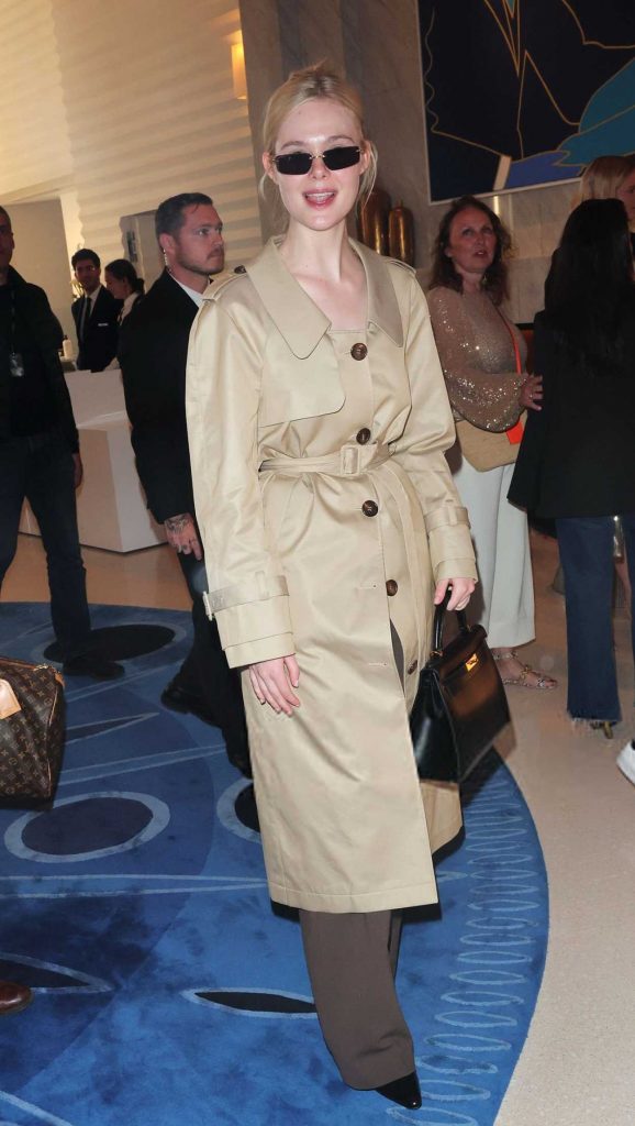 Elle Fanning in a Beige Trench Coat