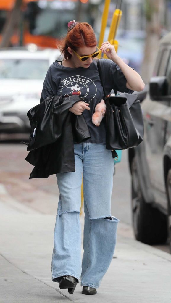 Emma Roberts in a Blue Ripped Jeans