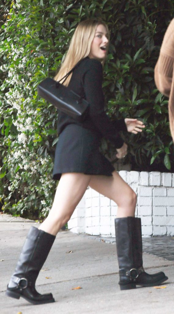 Margot Robbie in a Black Mini Dress