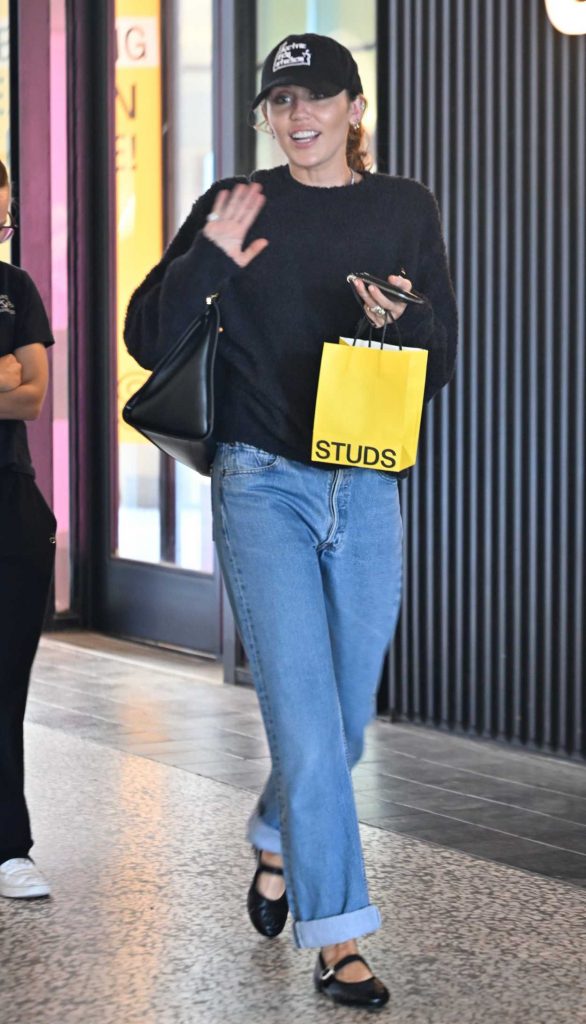 Miley Cyrus in a Black Cap