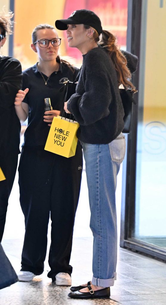 Miley Cyrus in a Black Cap