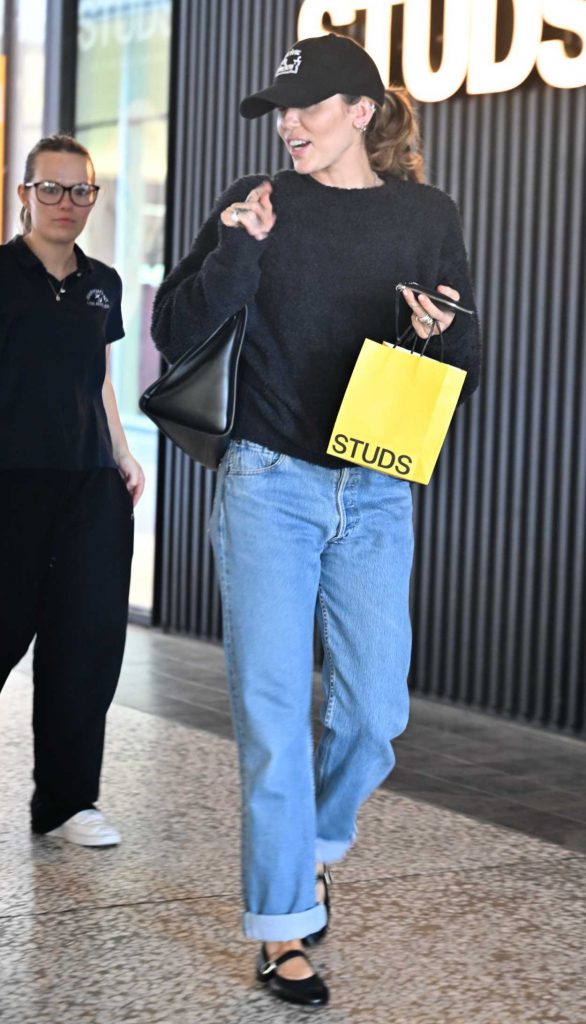 Miley Cyrus in a Black Cap