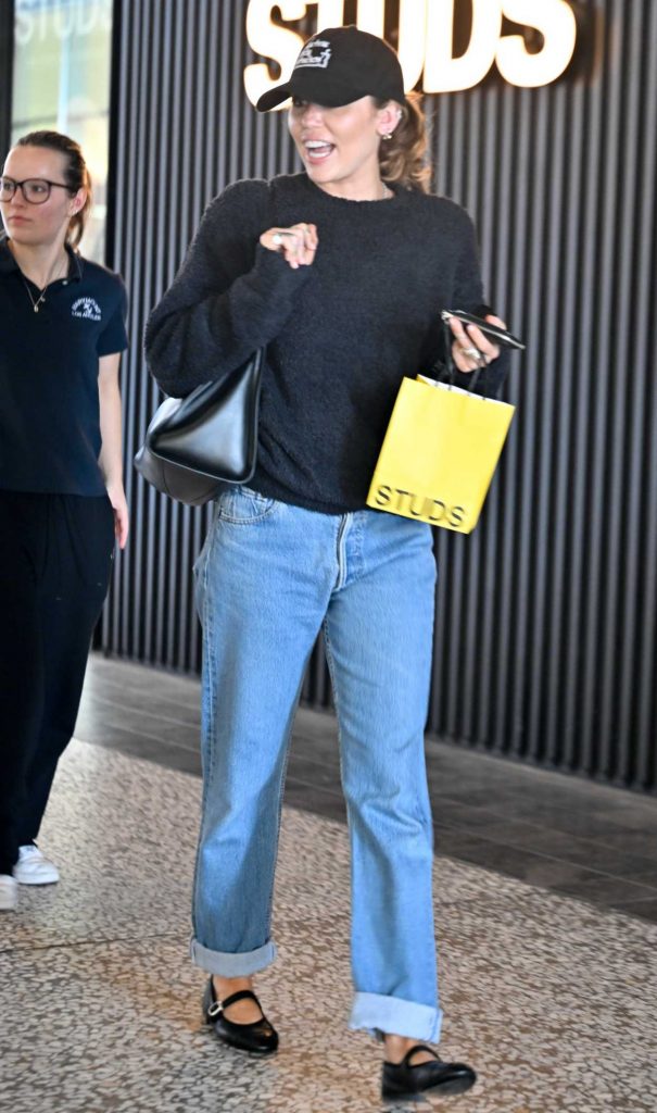 Miley Cyrus in a Black Cap