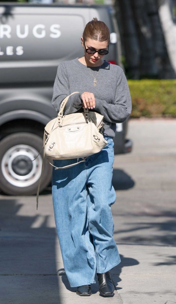 Olivia Jade in a Grey Sweater