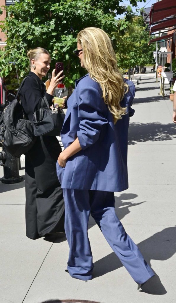 Brooks Nader in a Blue Pantsuit