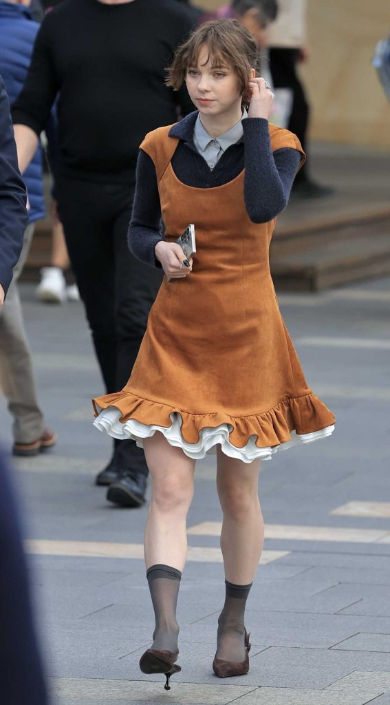 Emma Myers in a Tan Dress