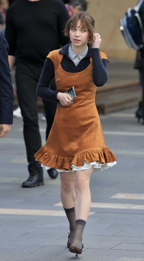 Emma Myers in a Tan Dress