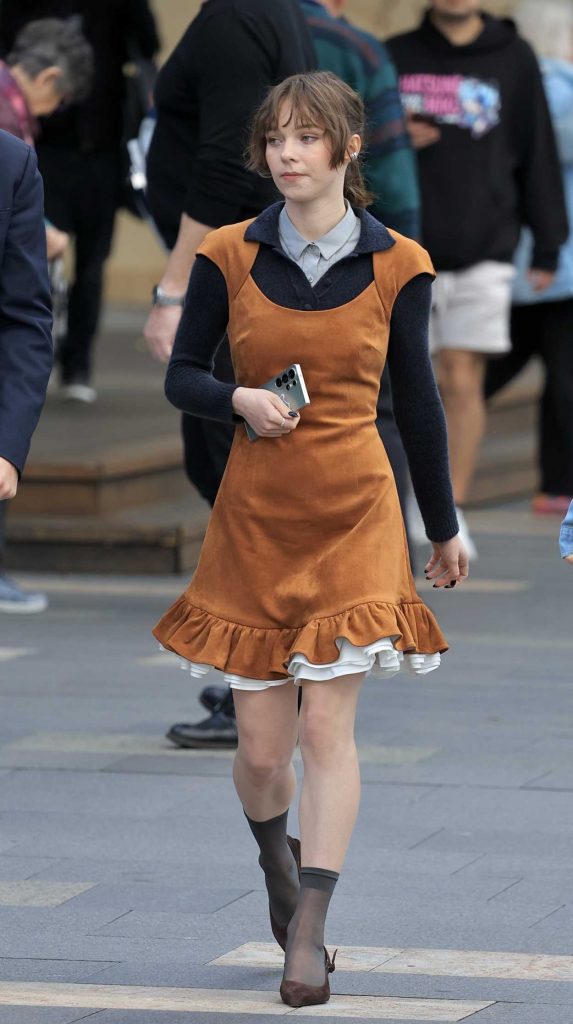 Emma Myers in a Tan Dress