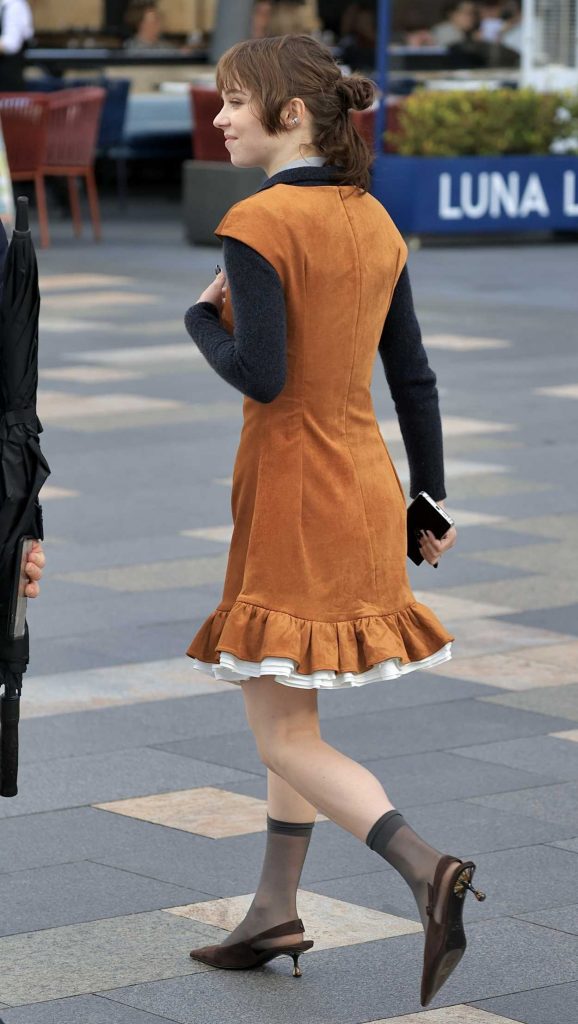 Emma Myers in a Tan Dress