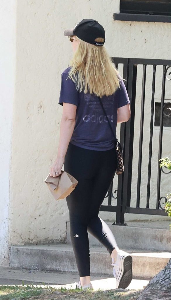 Kate Mara in a Black Cap