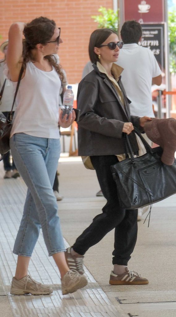 Lily Collins in a Black Sweatpants