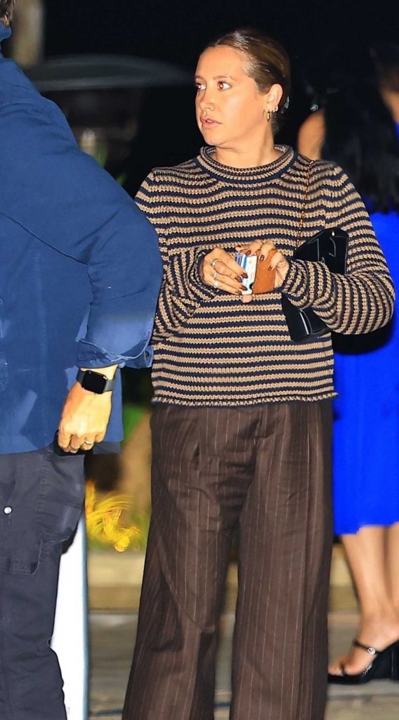 Ashley Tisdale in a Brown Pinstriped Pants