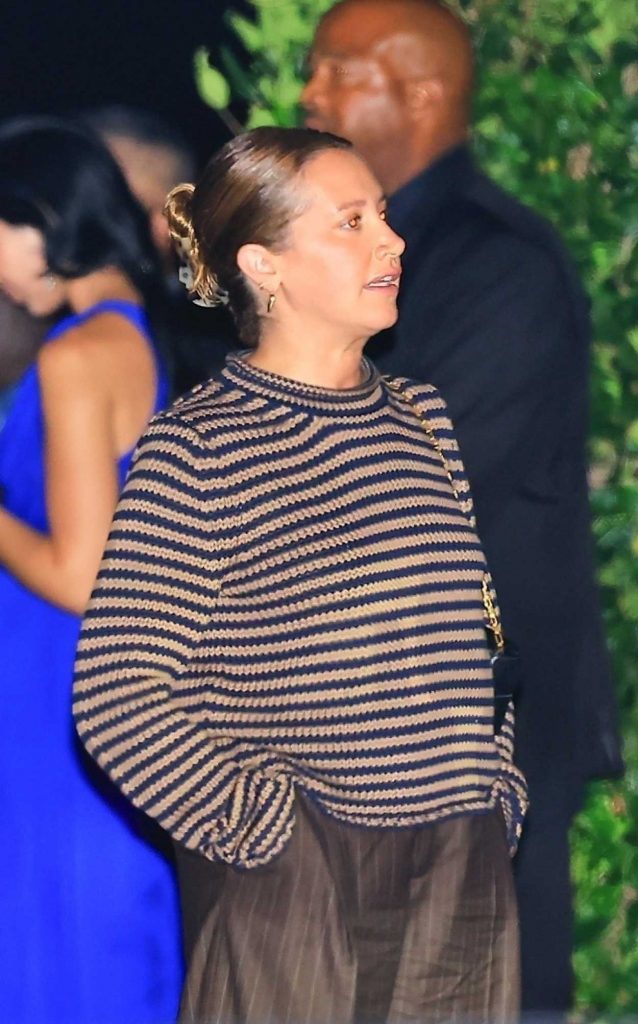 Ashley Tisdale in a Brown Pinstriped Pants