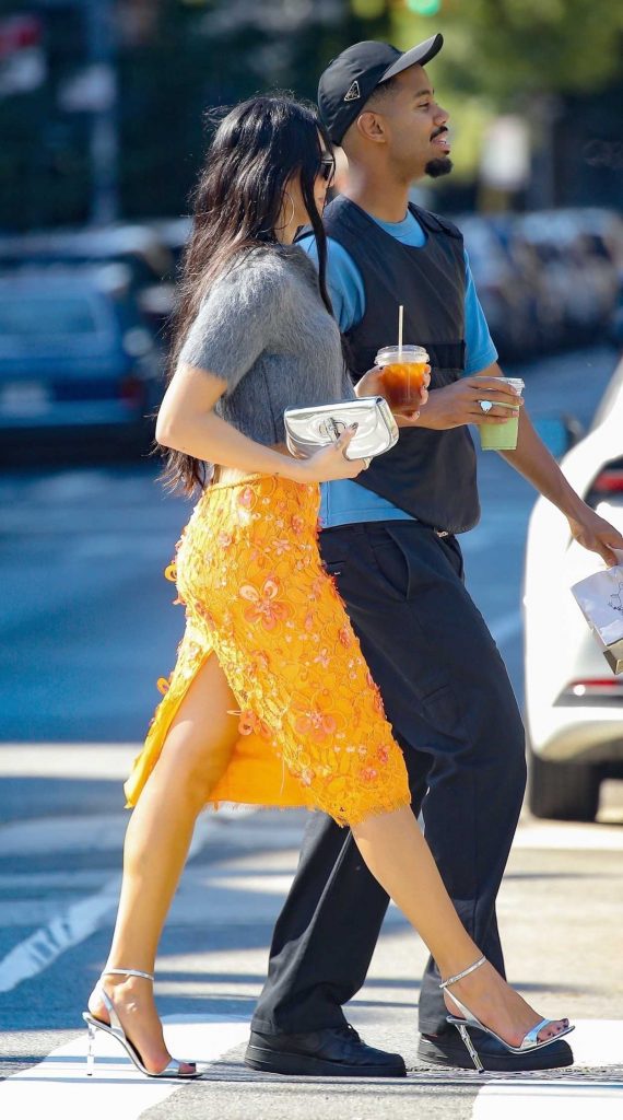 Dua Lipa in an Orange Gucci Floral Skirt