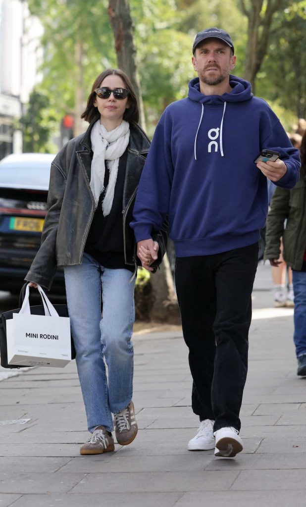 Lily Collins in a Black Leather Jacket