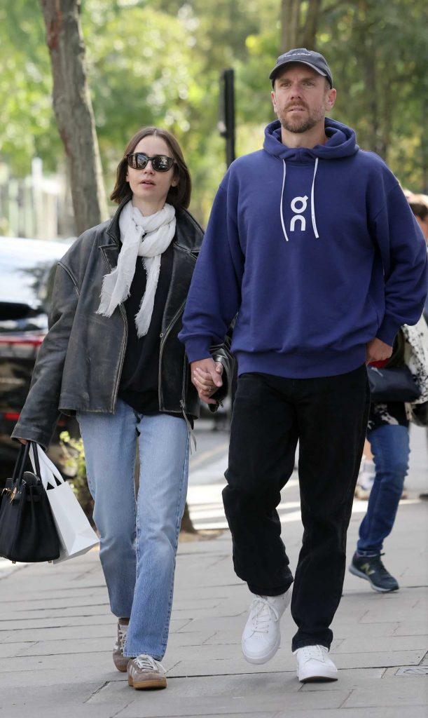 Lily Collins in a Black Leather Jacket