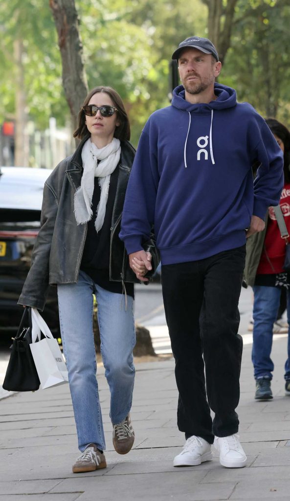 Lily Collins in a Black Leather Jacket