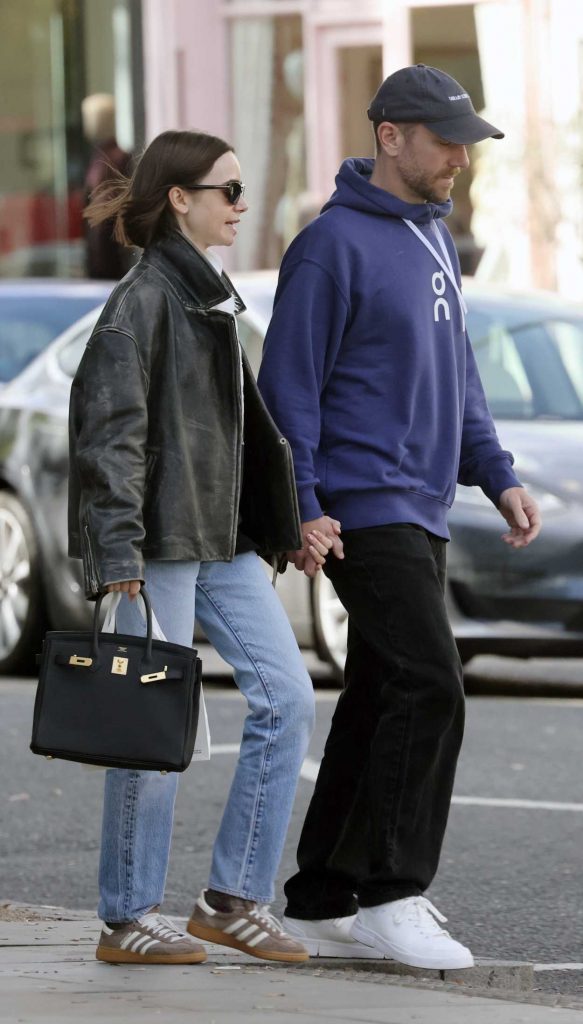 Lily Collins in a Black Leather Jacket