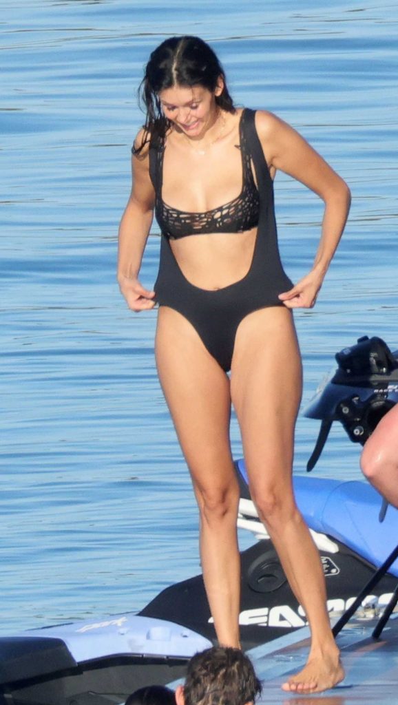 Nina Dobrev in a Black Swimsuit