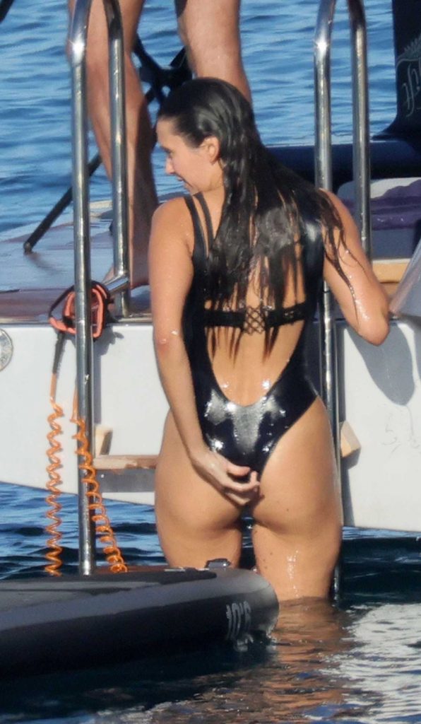 Nina Dobrev in a Black Swimsuit
