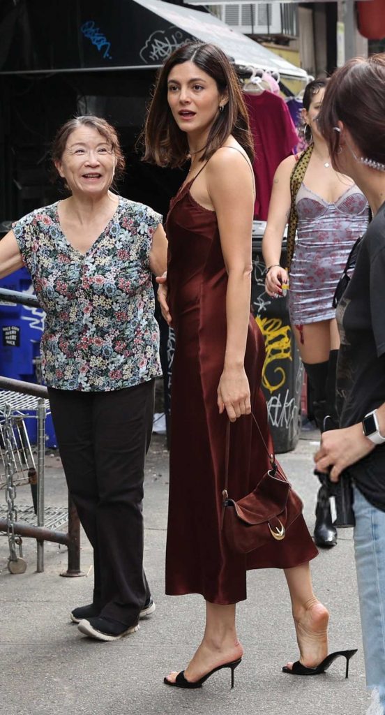 Monica Barbaro in a Brown Dress