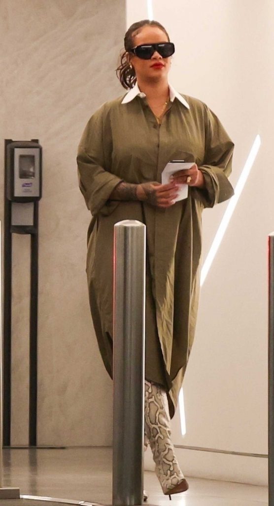 Rihanna in a Snakeskin Knee-Length Boots