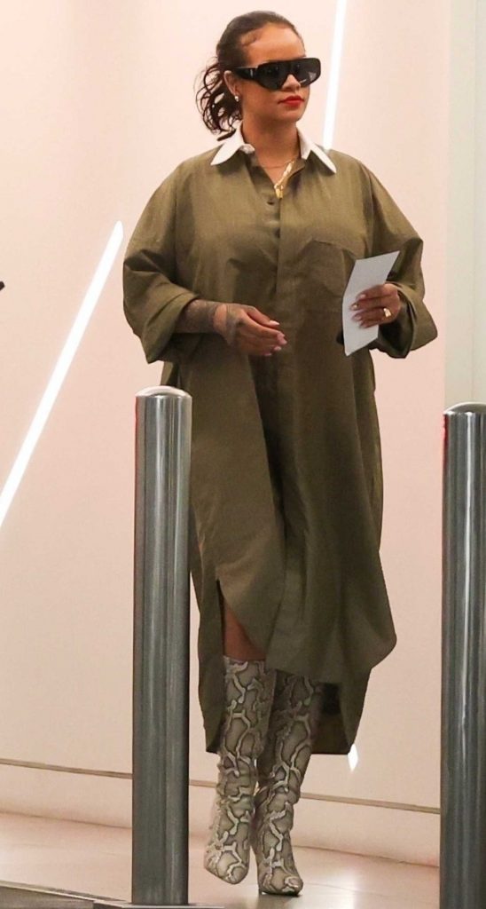 Rihanna in a Snakeskin Knee-Length Boots