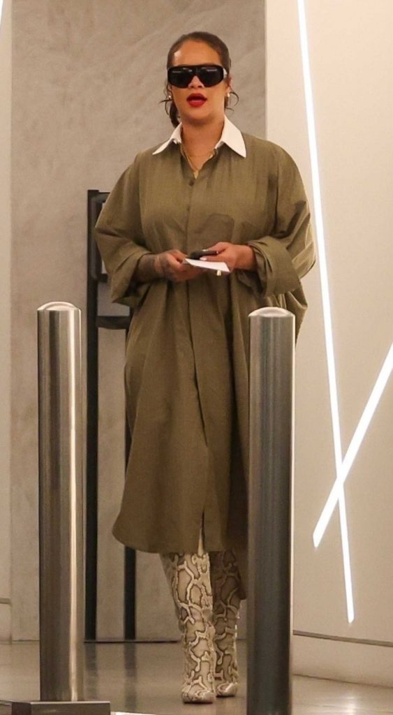 Rihanna in a Snakeskin Knee-Length Boots