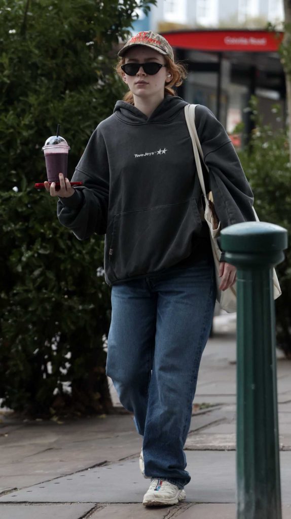 Sadie Sink in a Black Hoodie