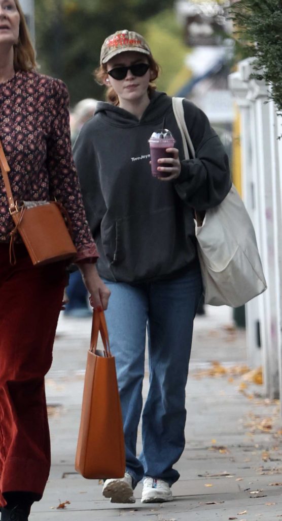 Sadie Sink in a Black Hoodie