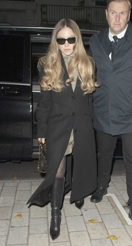 Sydney Sweeney in a Black Coat
