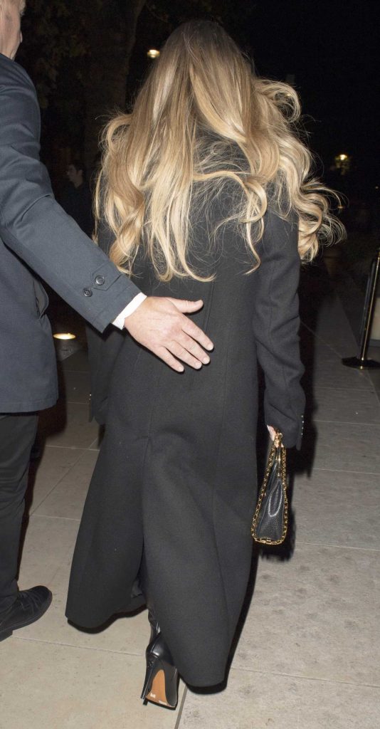 Sydney Sweeney in a Black Coat