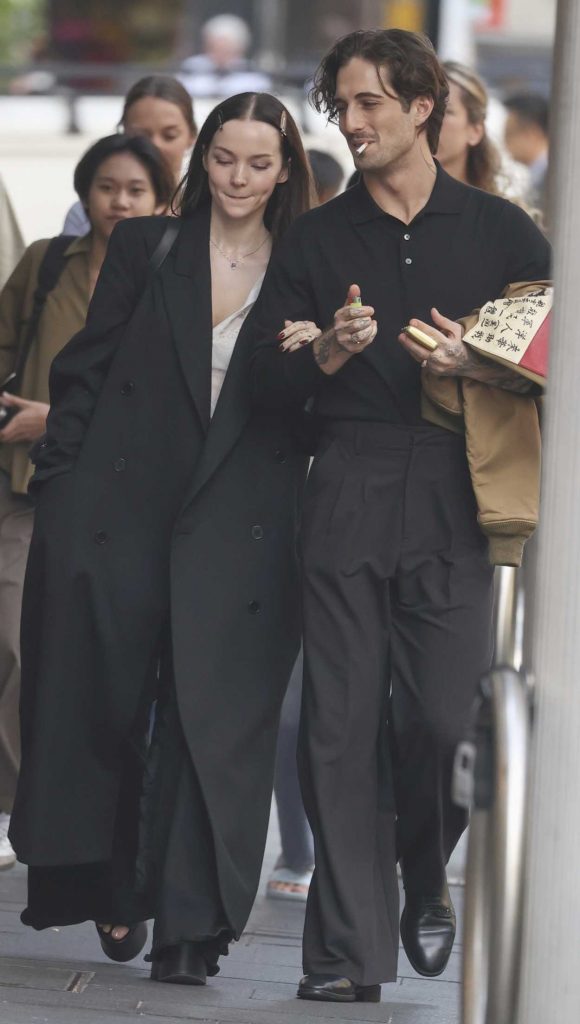 Dove Cameron in a Black Coat