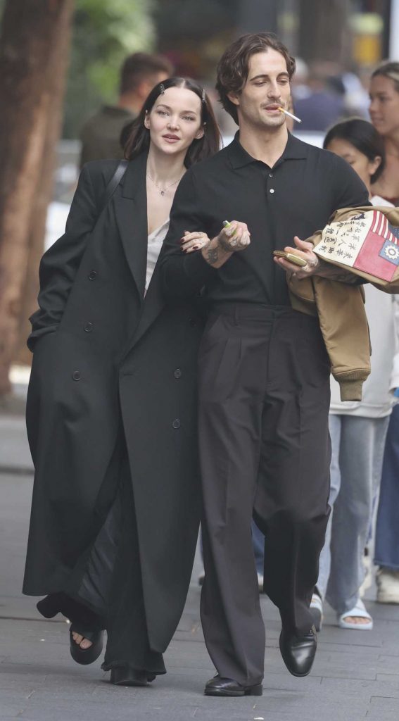 Dove Cameron in a Black Coat