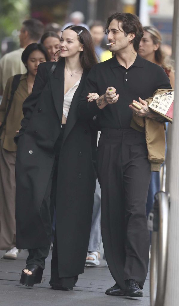 Dove Cameron in a Black Coat