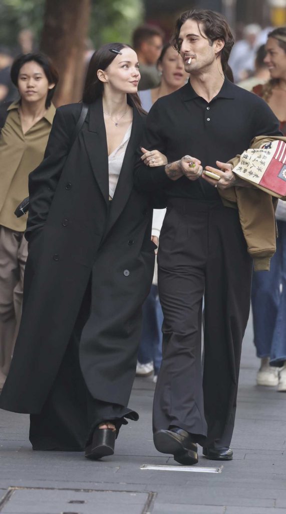 Dove Cameron in a Black Coat