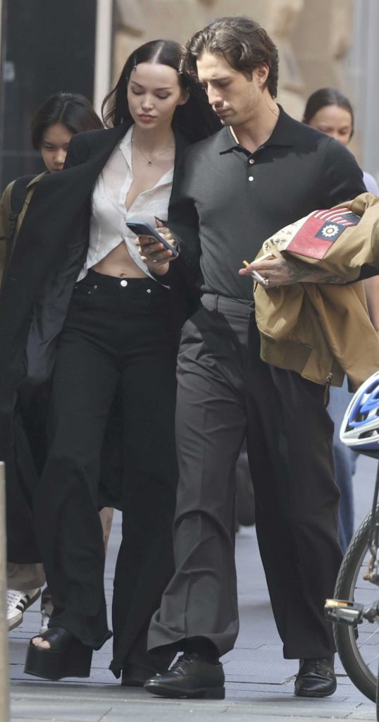 Dove Cameron in a Black Coat