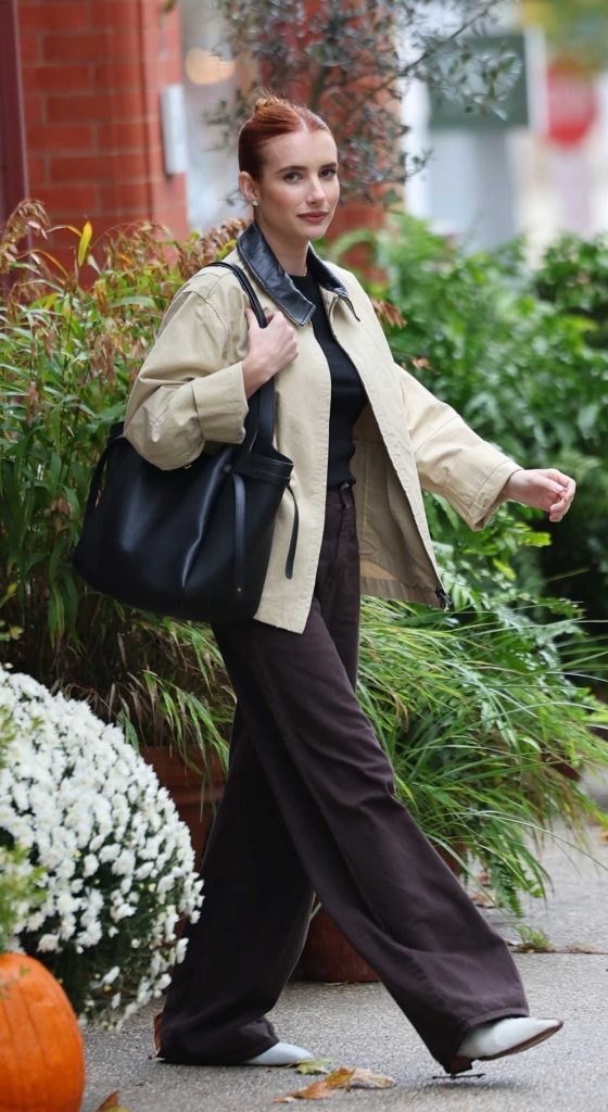 Emma Roberts in a Beige Jacket
