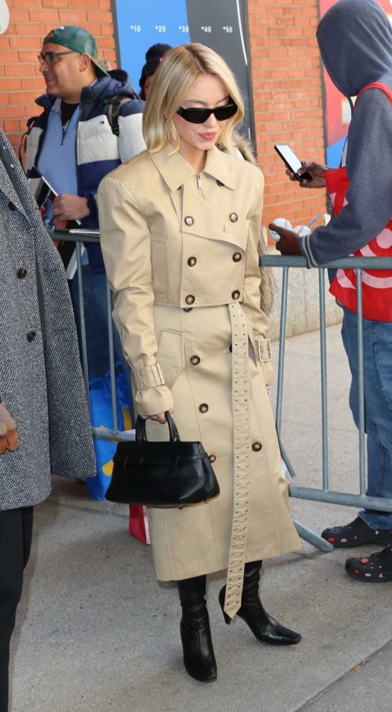 Sydney Sweeney in a Beige Trench Coat