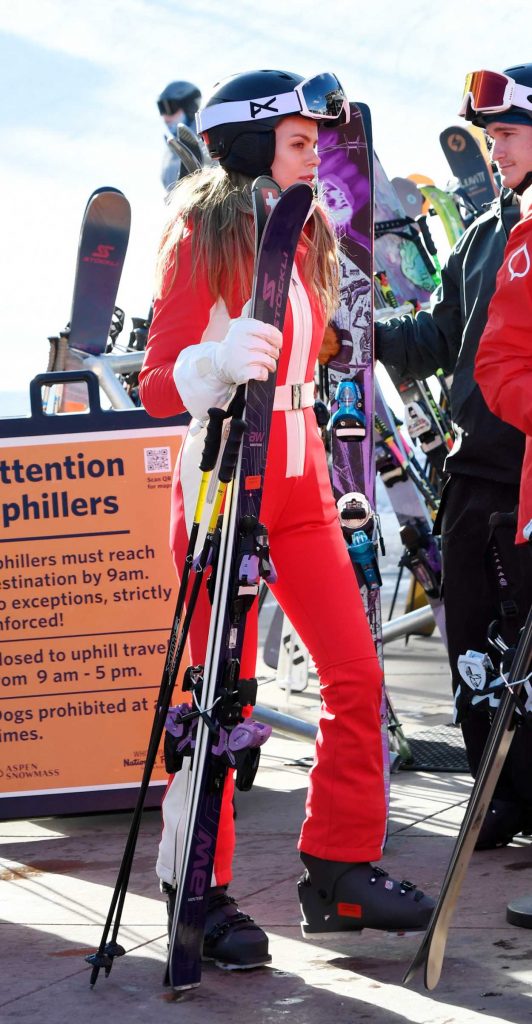 Brooks Nader in a Red Jumpsuit