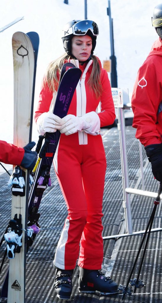 Brooks Nader in a Red Jumpsuit