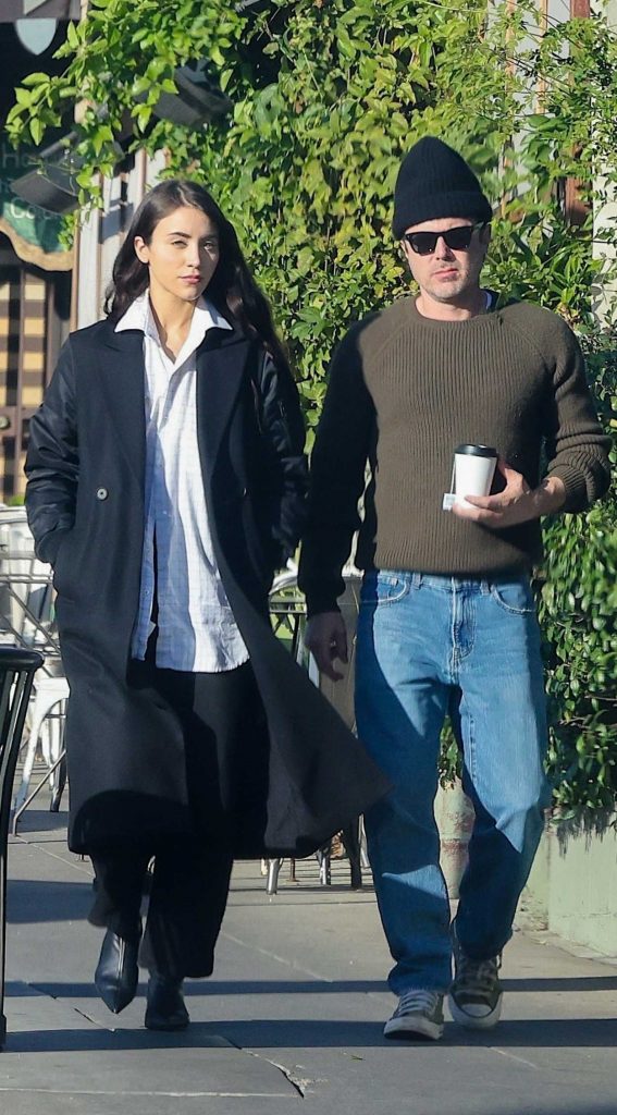 Caylee Cowan in a Black Coat