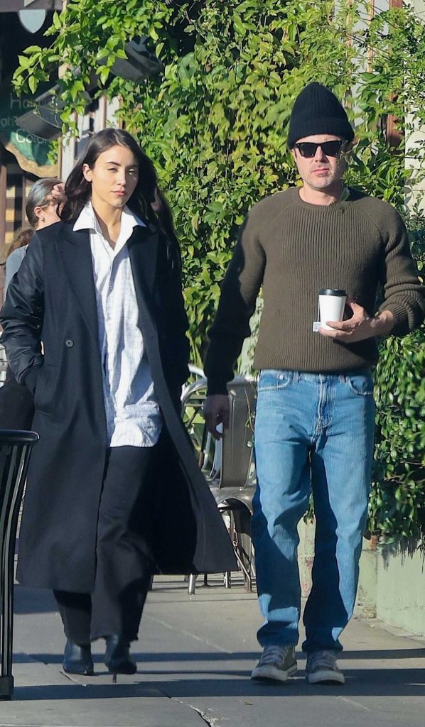 Caylee Cowan in a Black Coat