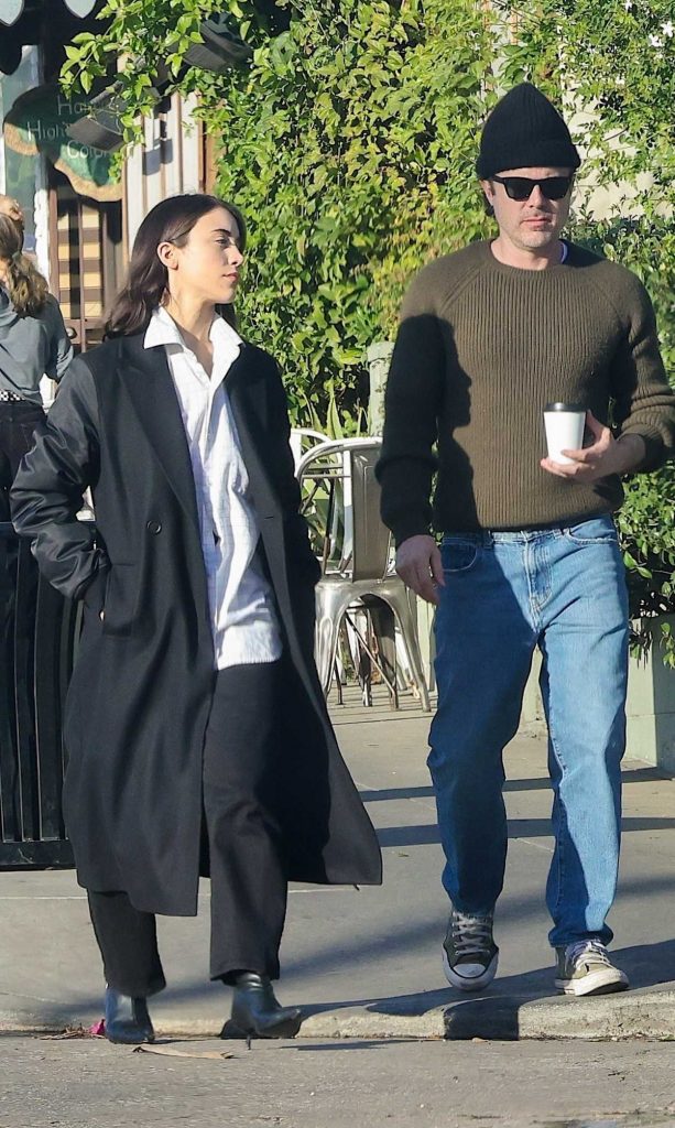 Caylee Cowan in a Black Coat