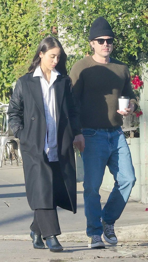 Caylee Cowan in a Black Coat