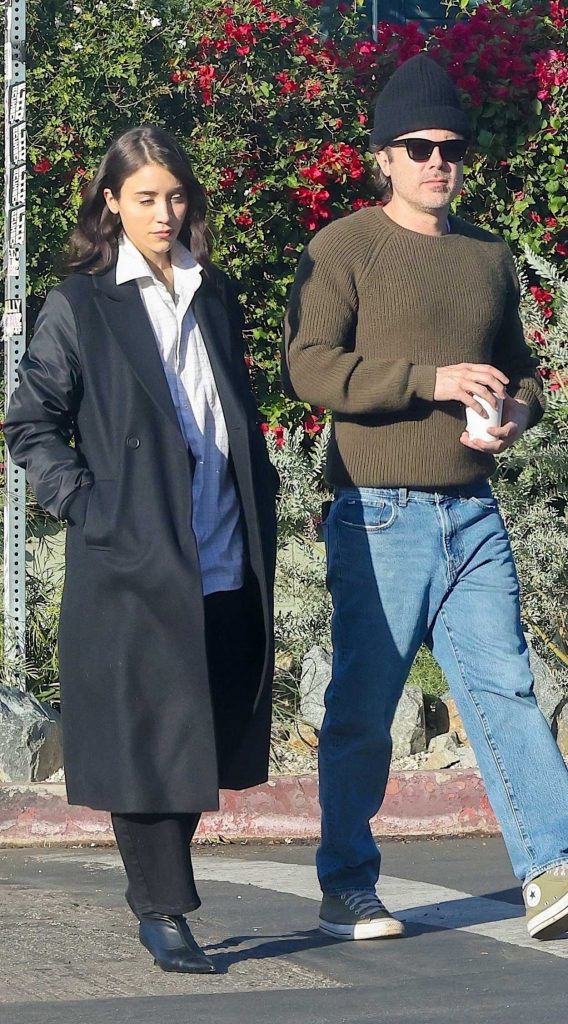 Caylee Cowan in a Black Coat