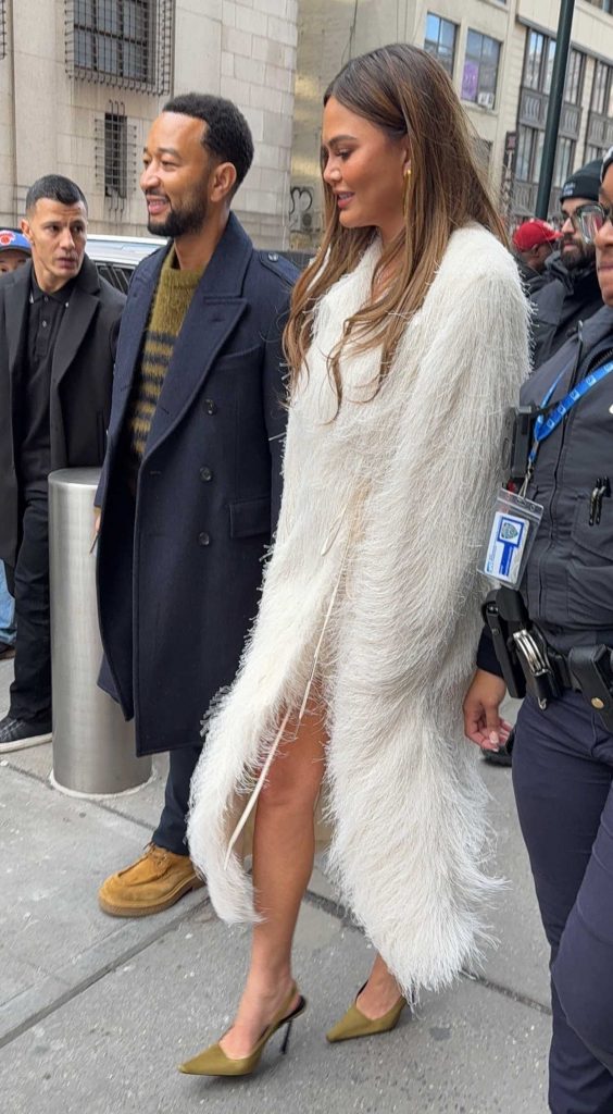 Chrissy Teigen in a White Fur Coat