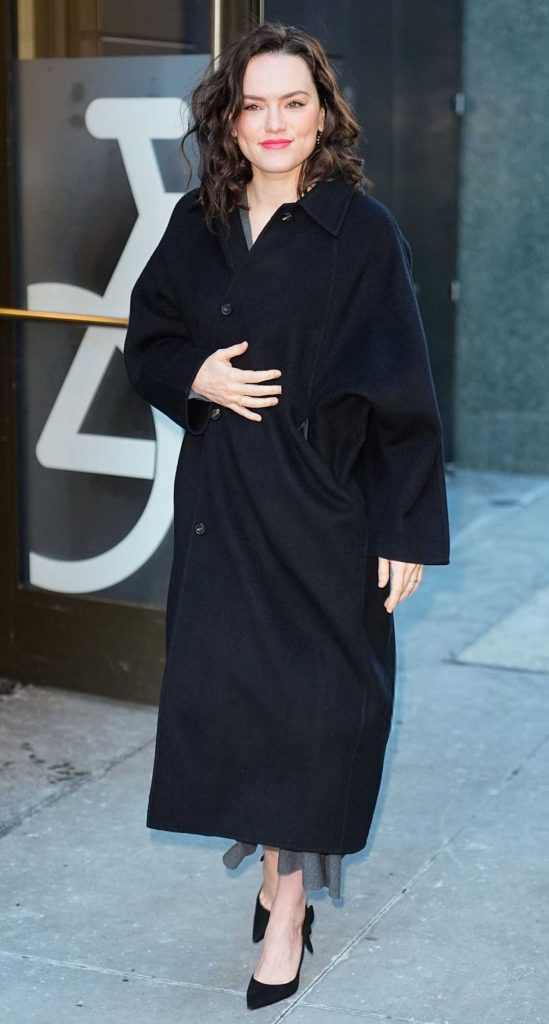 Daisy Ridley in a Black Coat