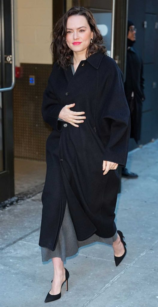Daisy Ridley in a Black Coat
