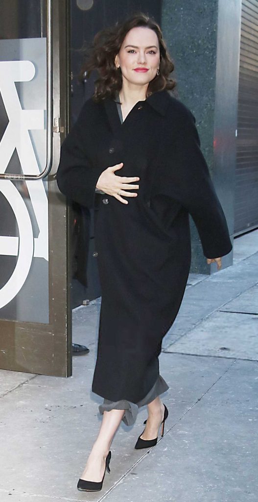 Daisy Ridley in a Black Coat